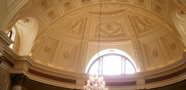 Part of the Reception Area at the Roman Baths, Bath. Image taken by me. Easily the most beautiful place I've ever queued!